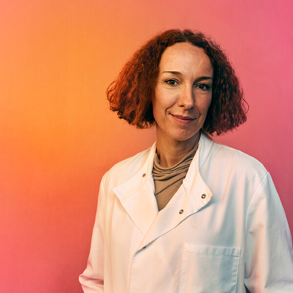 Picture of a scientist in a white lab coat